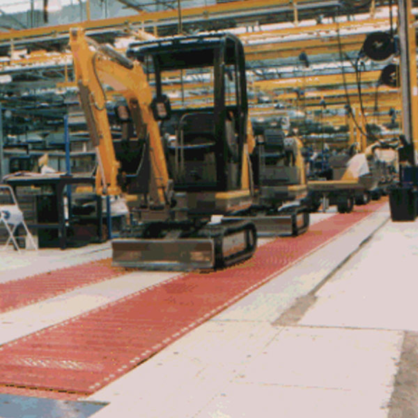 Mini excavators on an Amber Automation HD slat conveyors Mini excavators on an Amber Automation HD slat conveyors